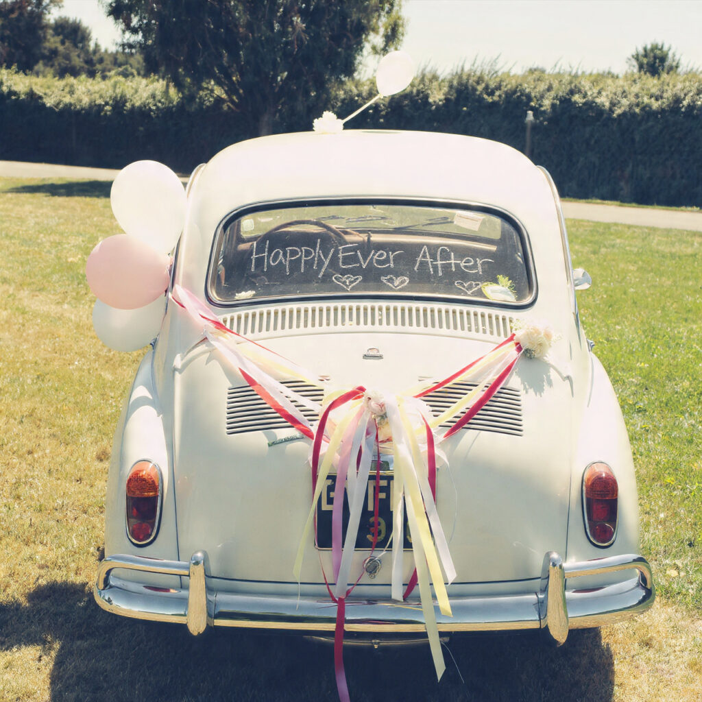 wedding car with playful messages like happily