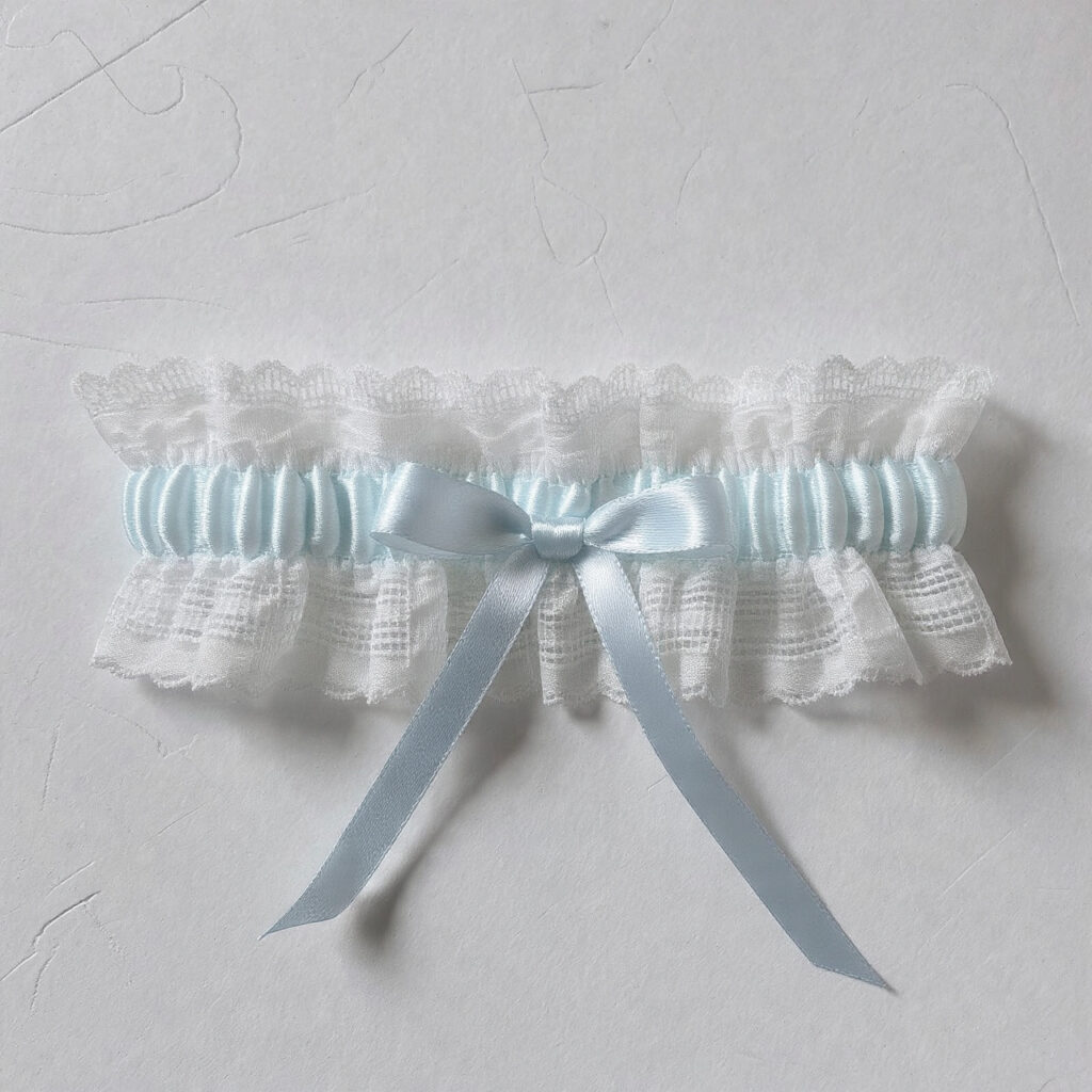 bridal garter with pale blue ribbon woven