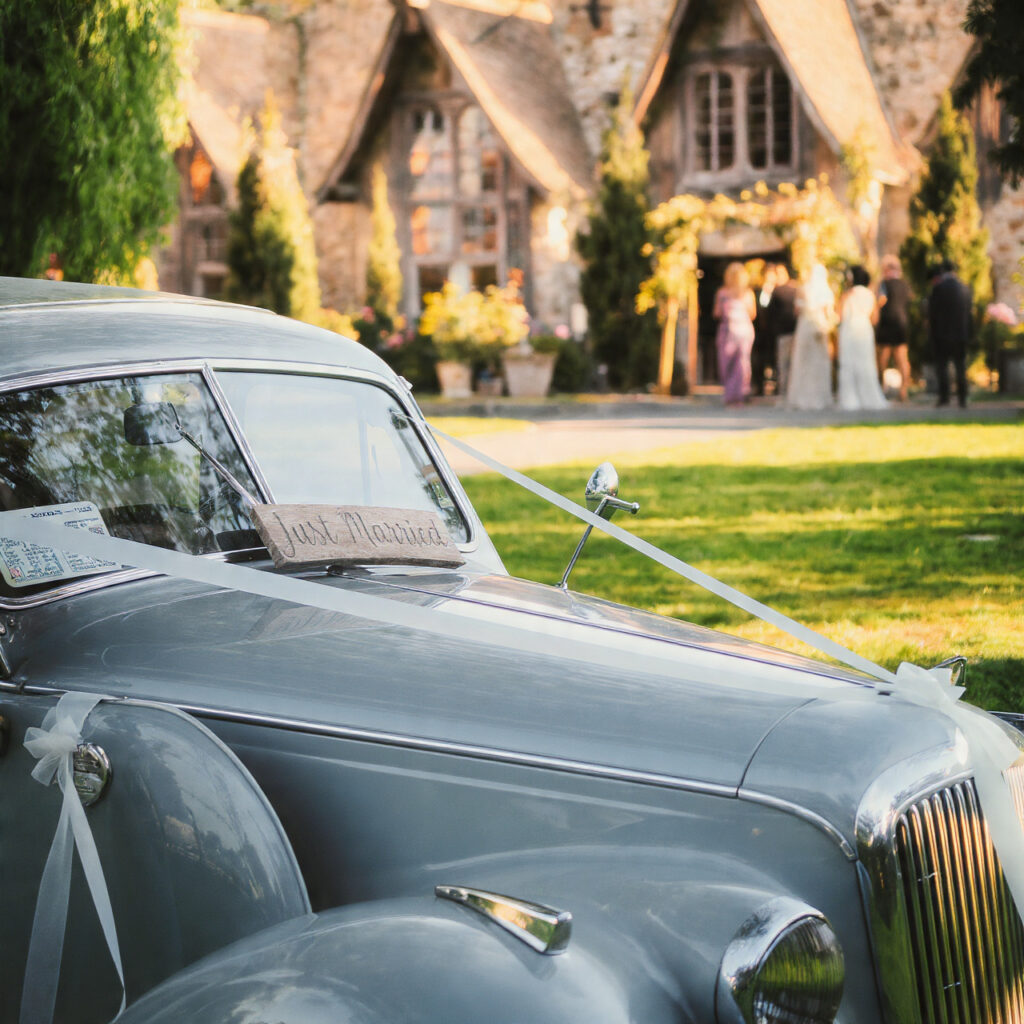 vintage car decorated with just married sign
