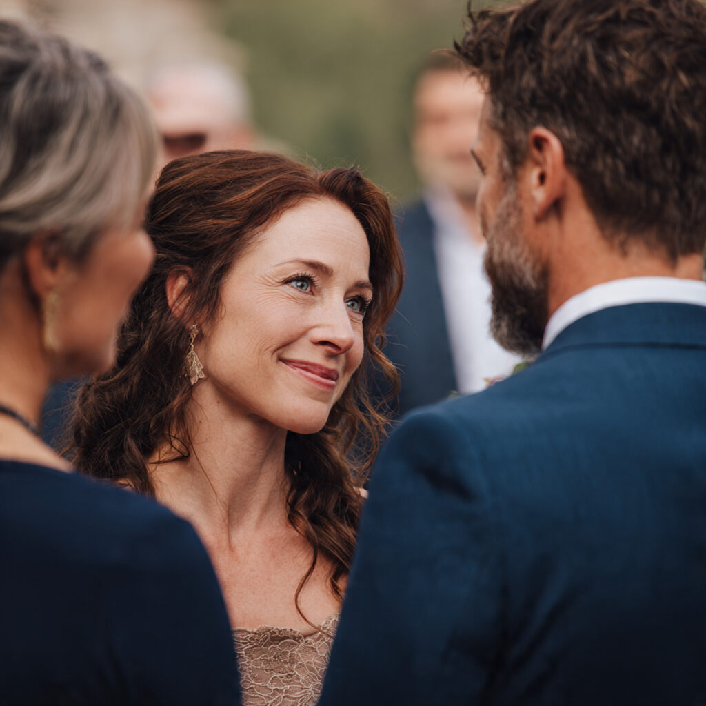 officiant speaking warmly to couple at wedding
