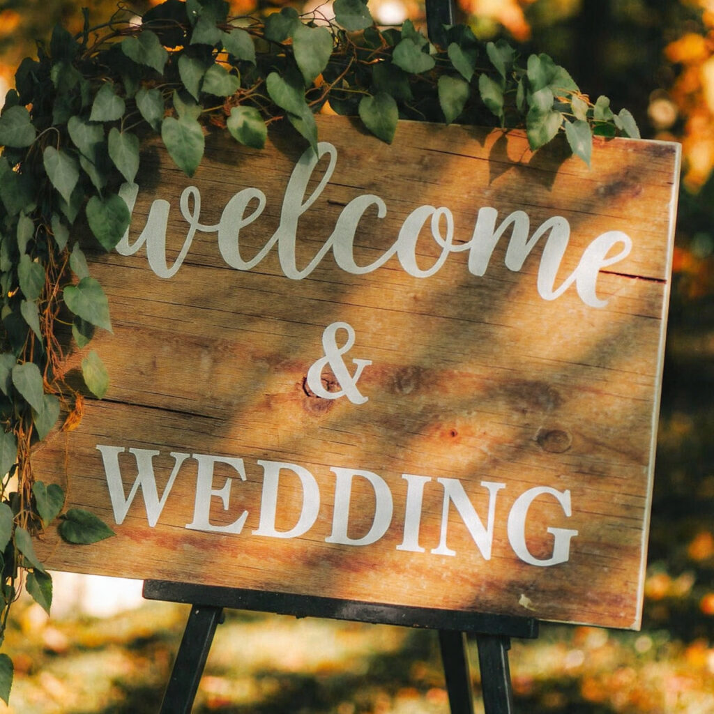 rustic wooden wedding welcome sign with white